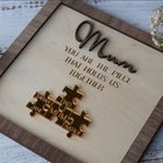 Load image into Gallery viewer, You Are The Piece That Holds Us Together Mom - Personalized Wooden Puzzle Sign
