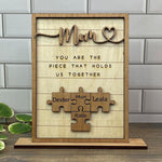 Load image into Gallery viewer, You Are The Piece That Holds Us Together Mom - Personalized Wooden Puzzle Sign
